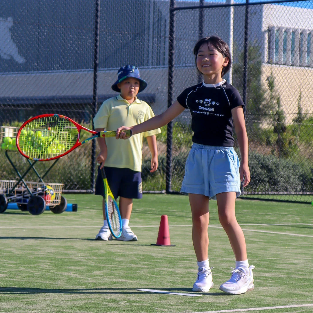 Junior tennis players on court at North Sydney Tennis and Fitness